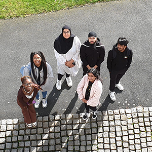 6 School of Art Students photographed from above outside the George Wallis Building