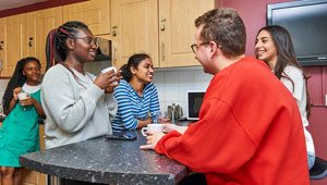 300 x 170 image showing group of students in halls kitchen